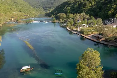 an aerial view of a river with boats on it at Holiday Houses Green Queen in Bihać