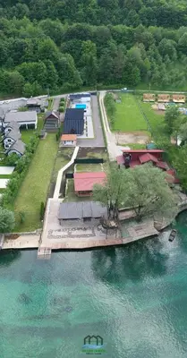 an aerial view of a park next to a body of water at Holiday Houses Green Queen in Bihać