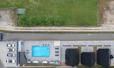 an overhead view of a building with a swimming pool at Holiday Houses Green Queen in Bihać