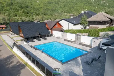 an overhead view of a swimming pool in front of a house at Holiday Houses Green Queen in Bihać