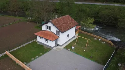 an aerial view of a house with a playground at Apartman Amina-Ahmad Vinac-Jajce in Jajce