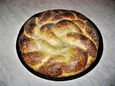 a loaf of bread in a pan on a table at Apatments Radoja - Pliva in Šipovo