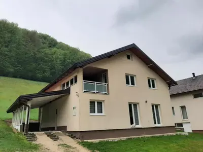 a house with a window on the side of it at Apartman Dujmović in Visoko