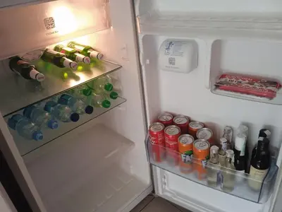 an open refrigerator filled with bottles and drinks at Apartment Lazarus Banja Luka in Banja Luka