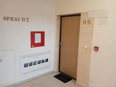 a door in a room with a sign on the wall at Apartment Lazarus Banja Luka in Banja Luka