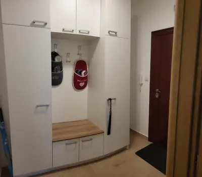 a room with a wall with a shelf and a helmet at Apartman Pati in Livno