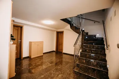an empty hallway with stairs in a house at Villa Lamija in Bihać
