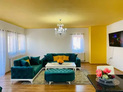 a living room with a couch and a table at Apartman Kula in Gradačac