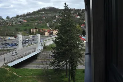 a view of a bridge over a road with cars at Park Lake - Germa in Tuzla