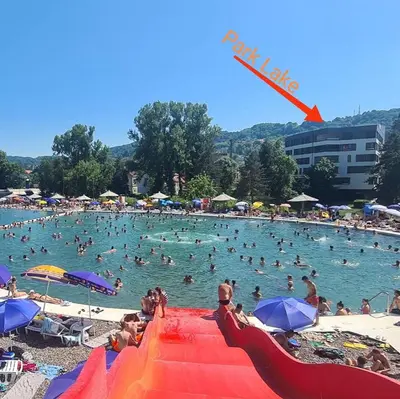 a group of people swimming in a pool at a beach at Park Lake - Germa in Tuzla