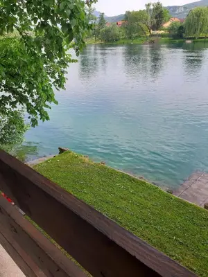 a view of a lake from a fence at Lahor in Bihać