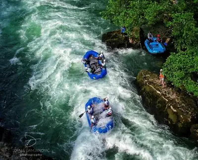 a group of people in rafts in a river at Villa Pampas in Banja Luka