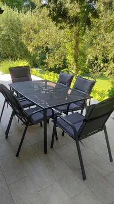 a black table and chairs sitting on a patio at Villa Pampas in Banja Luka