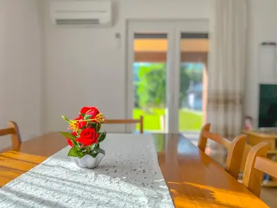 a vase of flowers sitting on a table at Daman Villa in Bihać