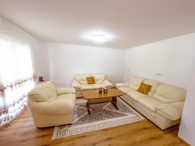 a living room with two couches and a coffee table at Daman Villa in Bihać