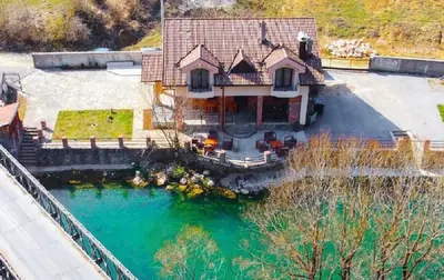 an aerial view of a house with a pool of water at Vila Sana in Landeke