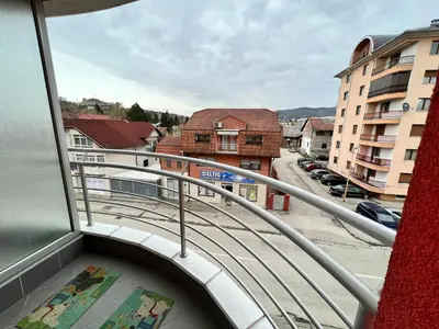 a balcony with a view of a street and buildings at Apartman Lana in Doboj