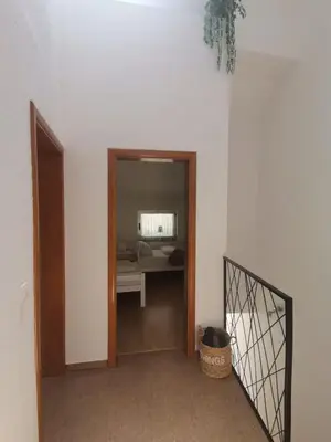 a hallway with a door leading to a room at King's Cave deluxe in Jajce