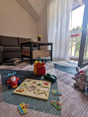 a living room with toys on the floor at King's Cave deluxe in Jajce