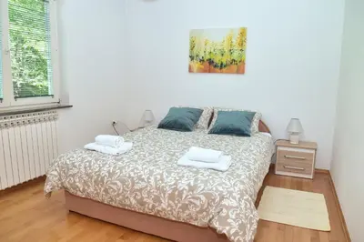 a bedroom with a bed with two towels on it at Apartman Buongiorno in Jajce