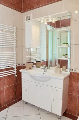 a bathroom with a white sink and a mirror at Apartman Buongiorno in Jajce