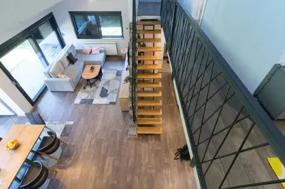 an overhead view of a living room with a staircase at Modern House in Visoko in Visoko