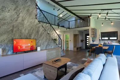 a living room with a couch and a tv at Modern House in Visoko in Visoko