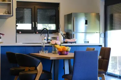 a kitchen with a table with a bowl of fruit on it at Modern House in Visoko in Visoko