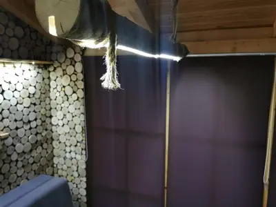 a feather hanging from the ceiling of a shower at Rest House Ripac in Praščijak