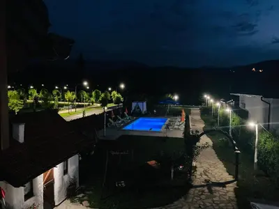 a view of a swimming pool at night at Holiday Home Bonum in Bihać