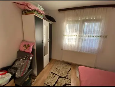 a small room with a bed and a window at Apartmani Piramida Mjeseca i Sunca in Visoko