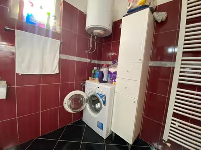a small bathroom with a washing machine in it at Apartmani Piramida Mjeseca i Sunca in Visoko