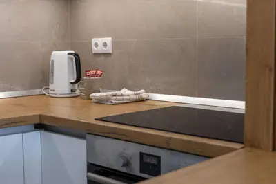 a kitchen counter with a toaster on a counter top at Drobac apartman in Banja Luka