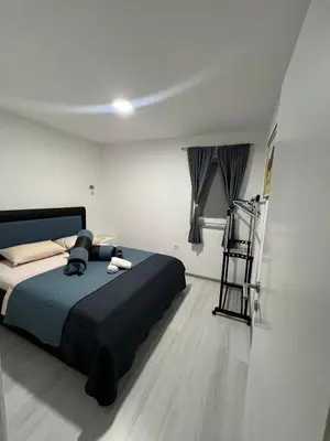 a bedroom with a bed and a ladder in it at Amani in Kovačevo Polje