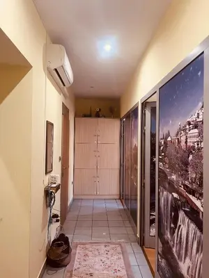 a hallway with a large painting on the wall at Apartman Vinkov's center in Jajce