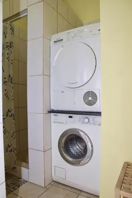 a washer and dryer in a small room at Apartman Vinkov's center in Jajce