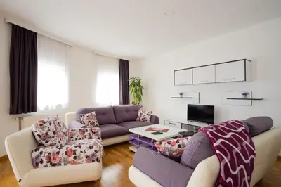 a living room with a couch and two chairs at Kašmir in Bugojno
