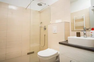 a bathroom with a shower and a toilet and a sink at Kašmir in Bugojno