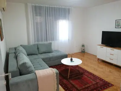 a living room with a couch and a table at IKA-M in Bihać