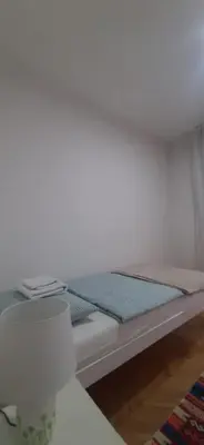 a small bed in a room with a mattress at IKA-M in Bihać