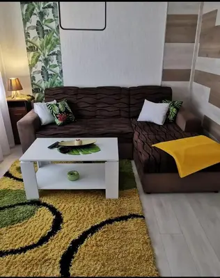 a living room with a couch and a coffee table at Teslić Apartman NiA in Teslić
