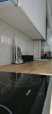 a kitchen with a counter with utensils on it at Teslić Apartman NiA in Teslić
