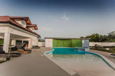 a swimming pool in the backyard of a house at Grand villa Bosnae in Bihać