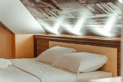 a bed with two white pillows on top of it at Grand villa Bosnae in Bihać