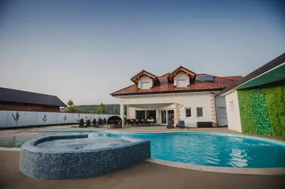 a swimming pool in the backyard of a house at Grand villa Bosnae in Bihać