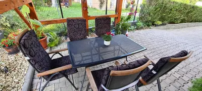 a black table and chairs on a patio at Apartman Stari Grad - Ostrožac na Uni - Bihać Cazin in Ostrožac