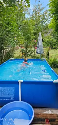 a person in a swimming pool with at Apartman Stari Grad - Ostrožac na Uni - Bihać Cazin in Ostrožac