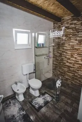 a bathroom with a toilet and a shower at Villa Vanesa Bihać in Bihać
