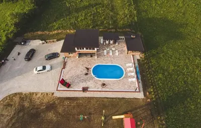 an aerial view of a house with a swimming pool at Villa Vanesa Bihać in Bihać