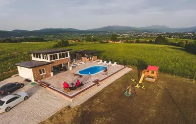 an aerial view of a house with a swimming pool at Villa Vanesa Bihać in Bihać